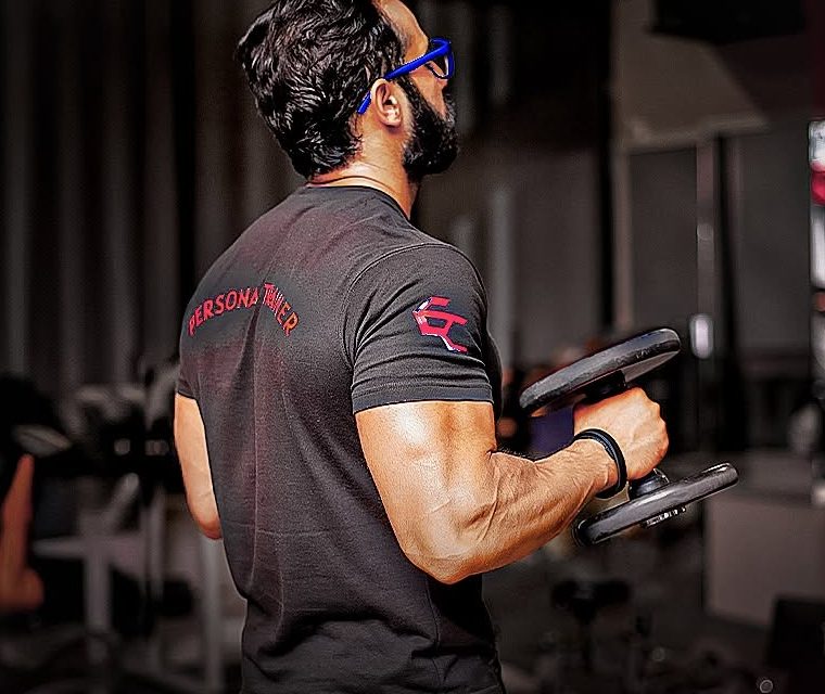 Trainer with dumbbell