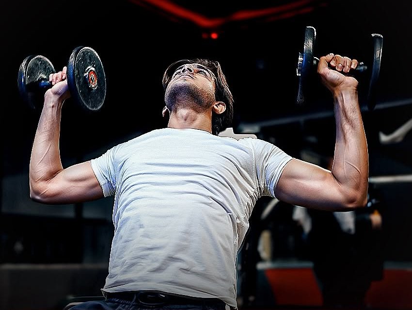 Member lifting dumbbells at Executive Club